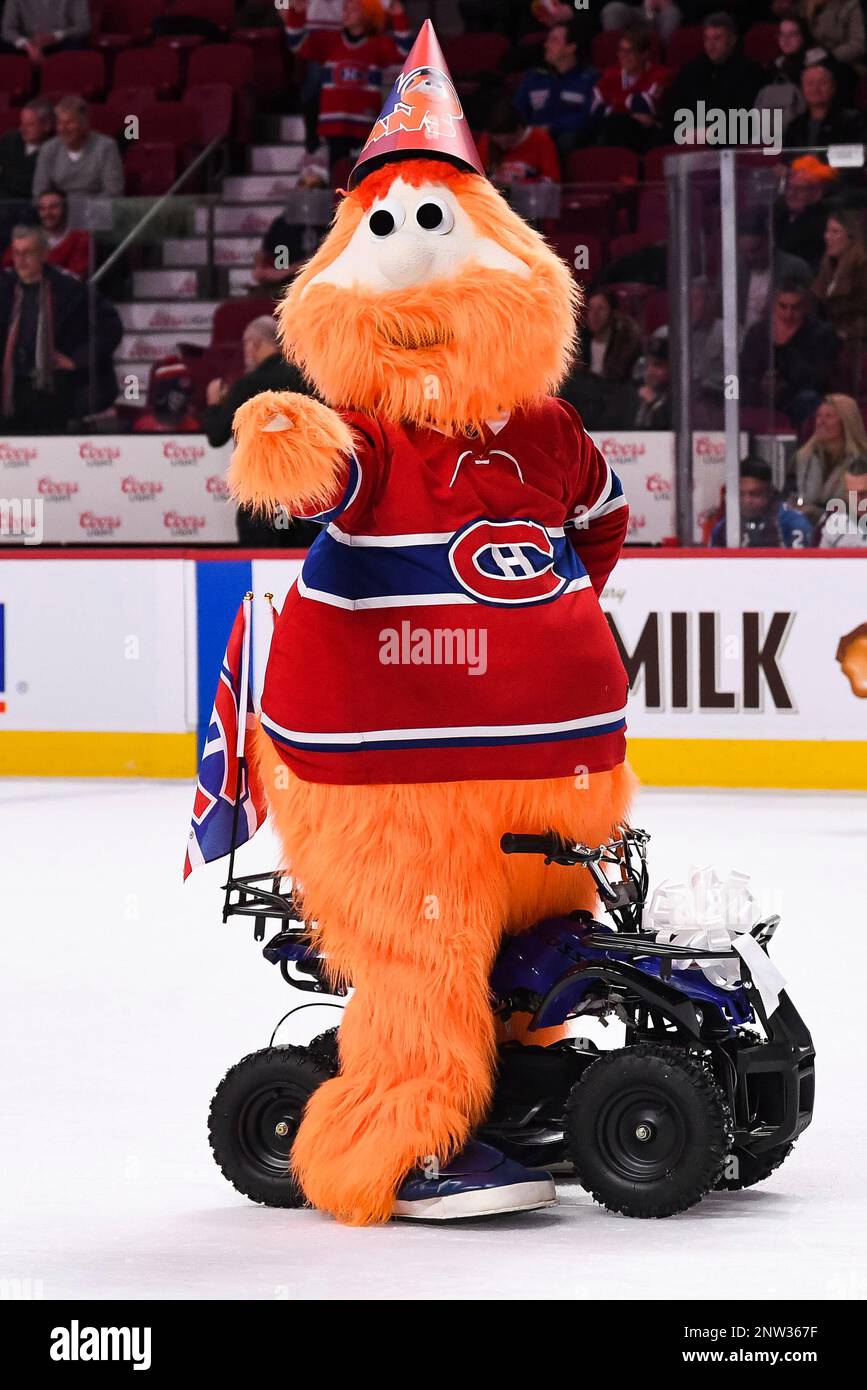 Montreal Canadiens mascot Youppi, left, is held aloft by Nashville
