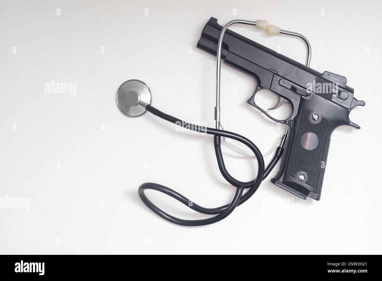 stethoscope and gun, concept for dangers faced by front line medical ...