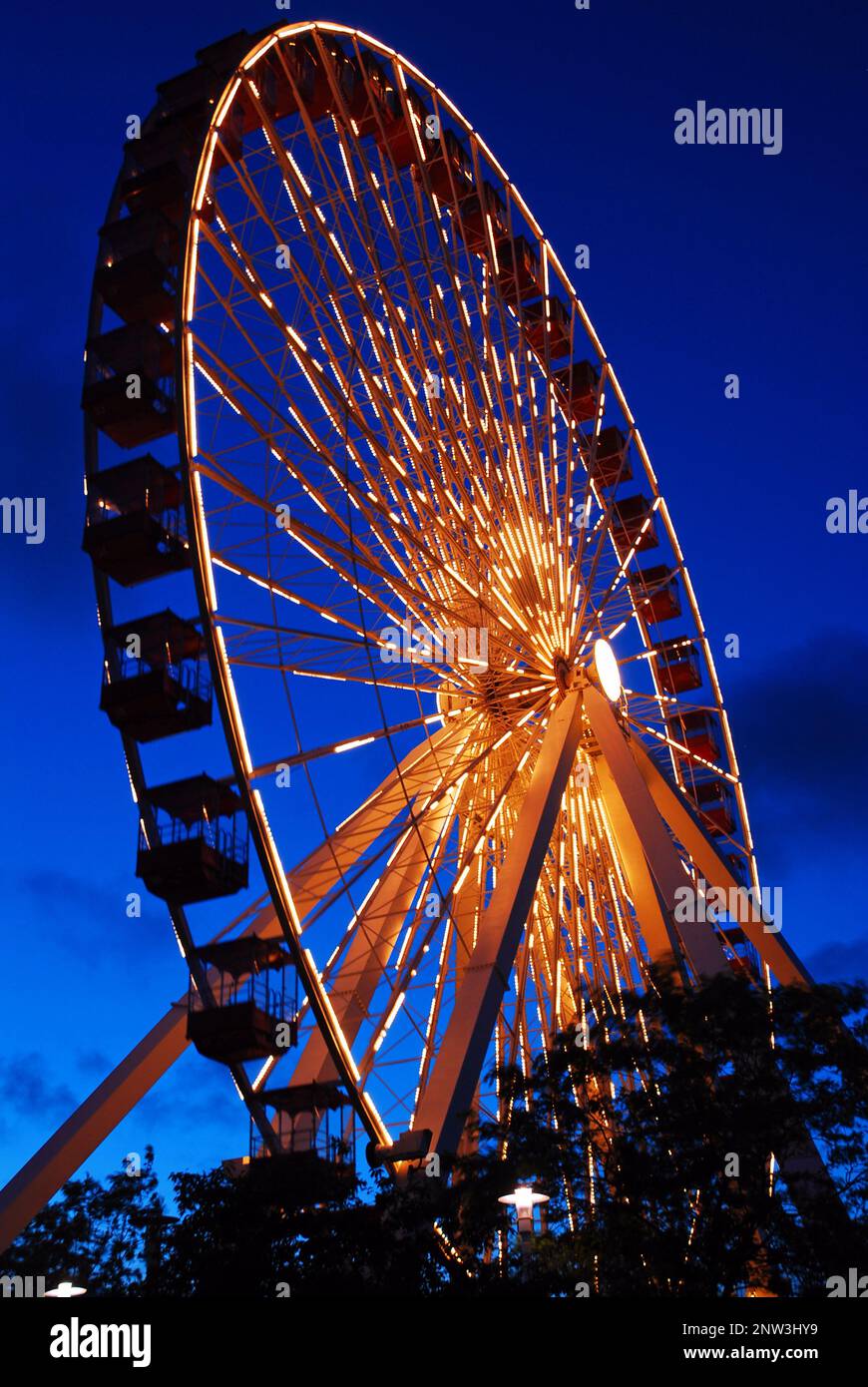 The Navy Pier Ferris wheel glows at dusk Stock Photo