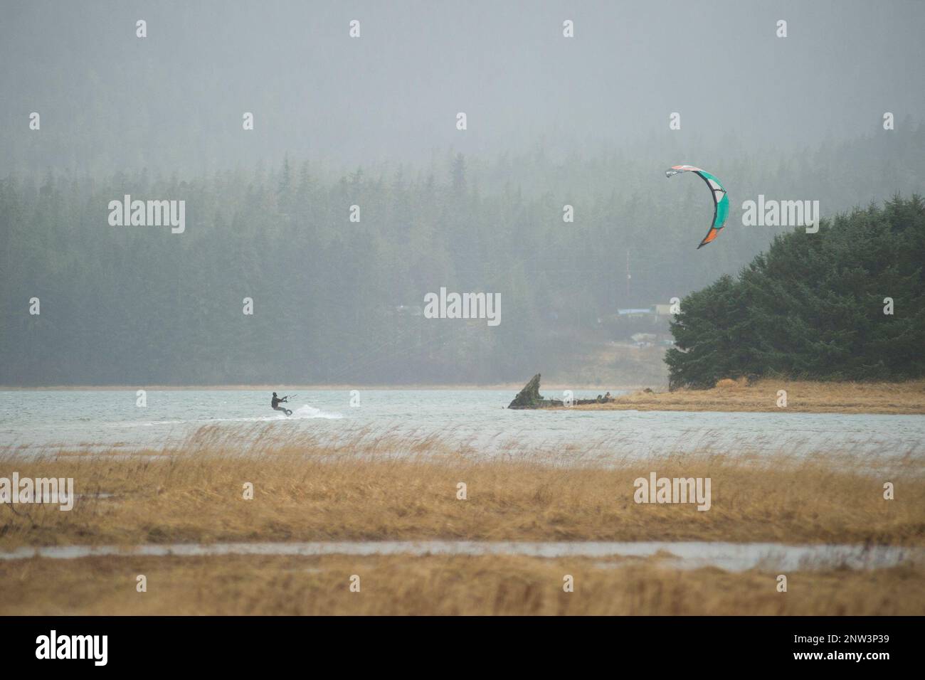 In this Sunday, Dec. 9, 2018, photo, Rob Cadmus kiteboards in the