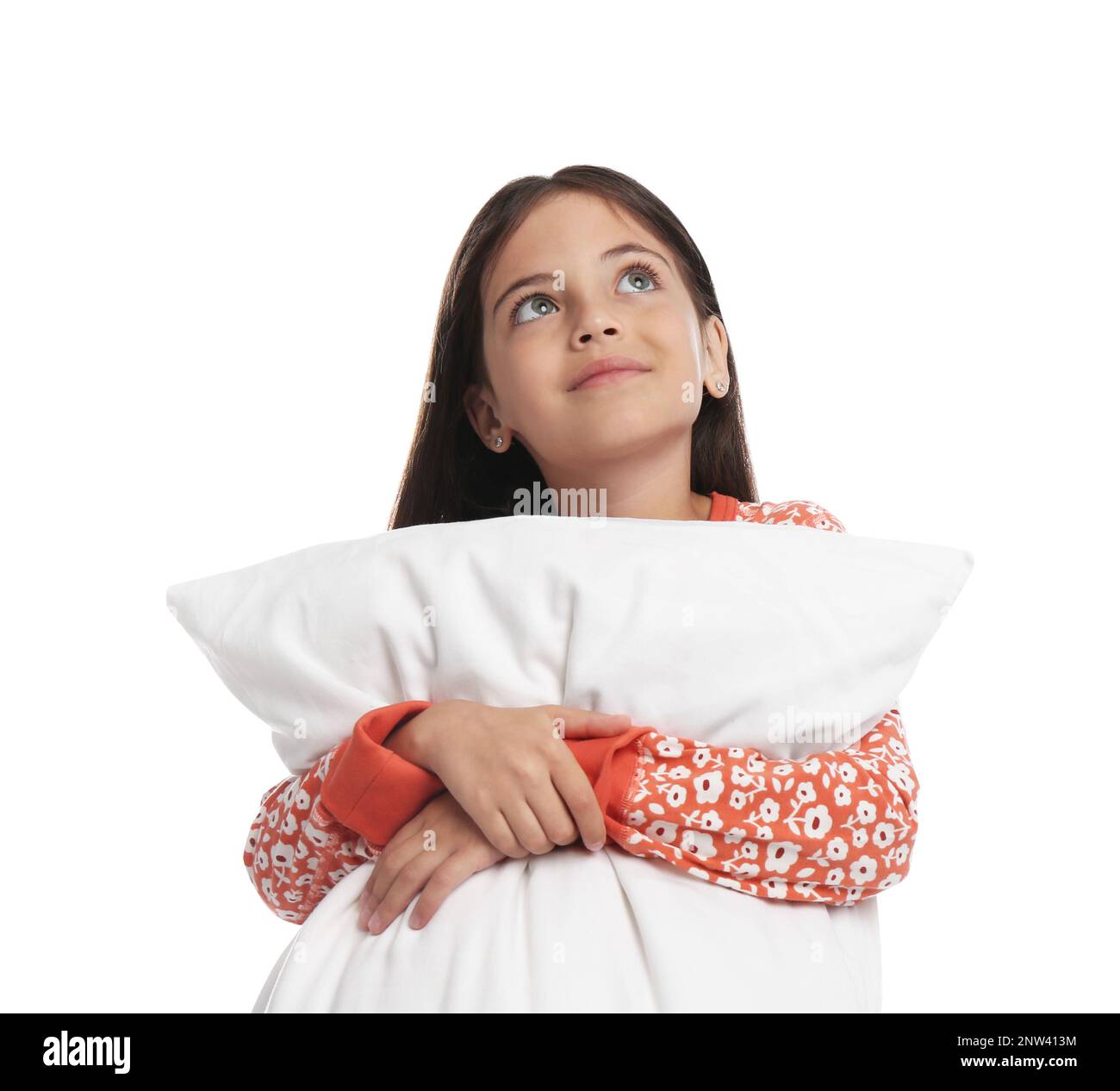 Cute girl wearing pajamas with pillow on white background Stock Photo ...