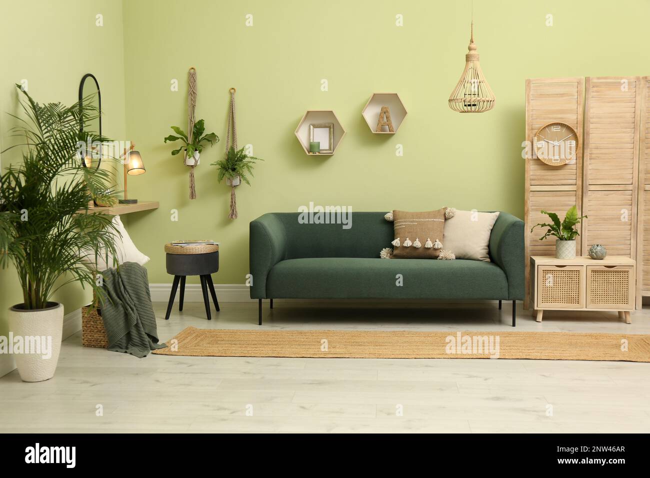 Living room with comfortable green sofa. Interior design Stock Photo ...