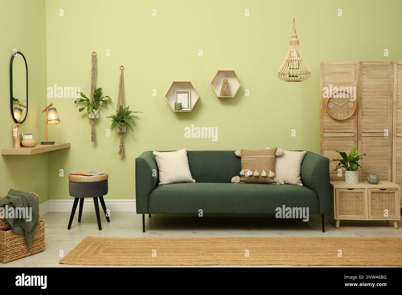 Living room with comfortable green sofa. Interior design Stock Photo