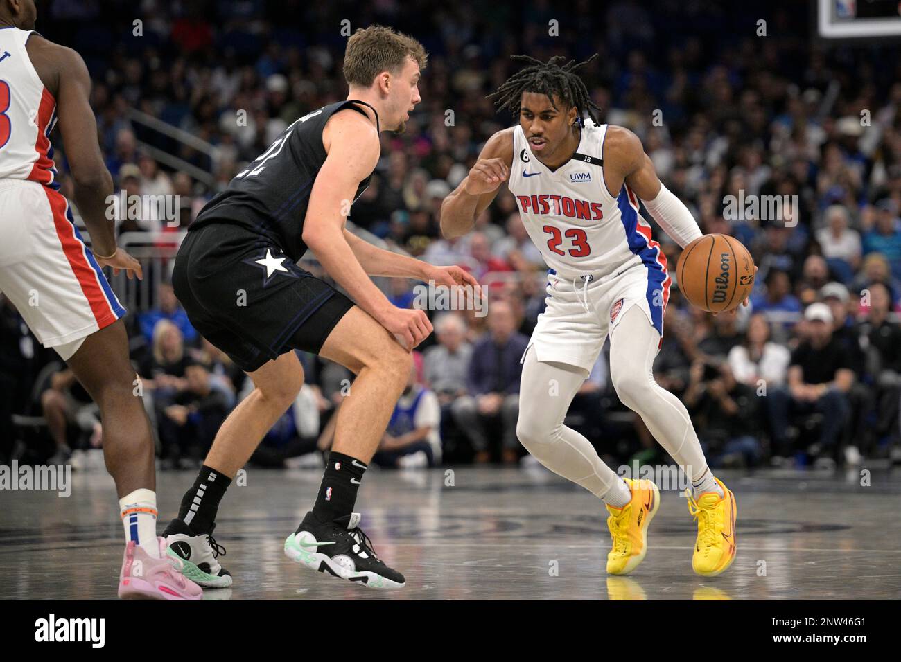 Detroit Pistons guard Jaden Ivey (23) is defended by Orlando Magic
