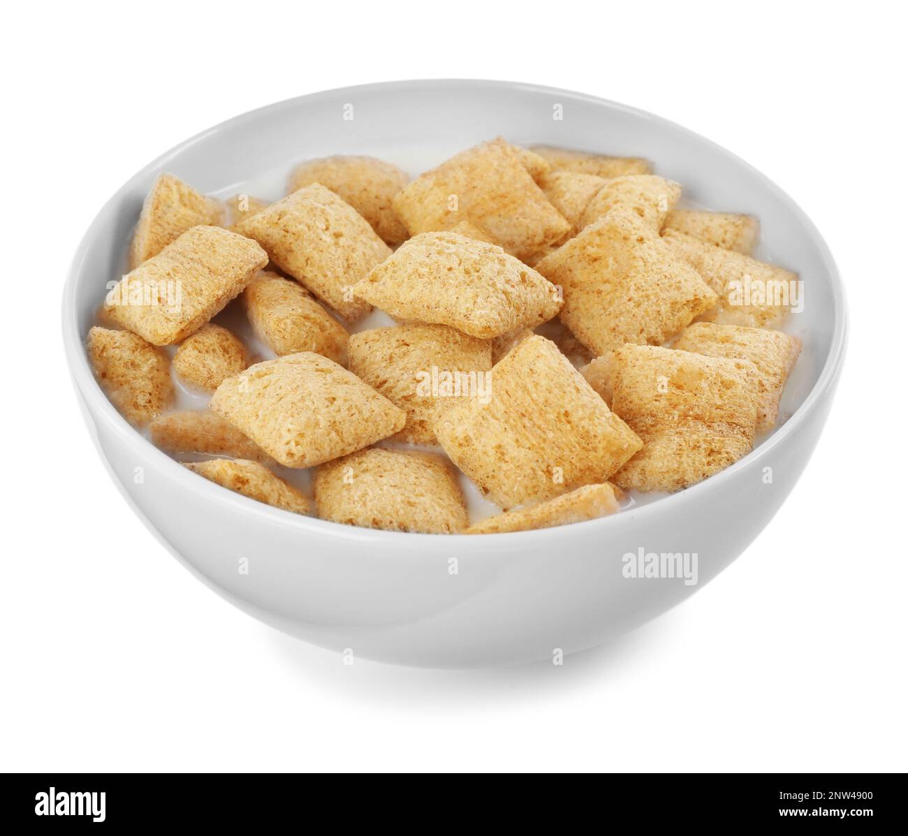 Tasty corn pads with milk in bowl isolated on white Stock Photo