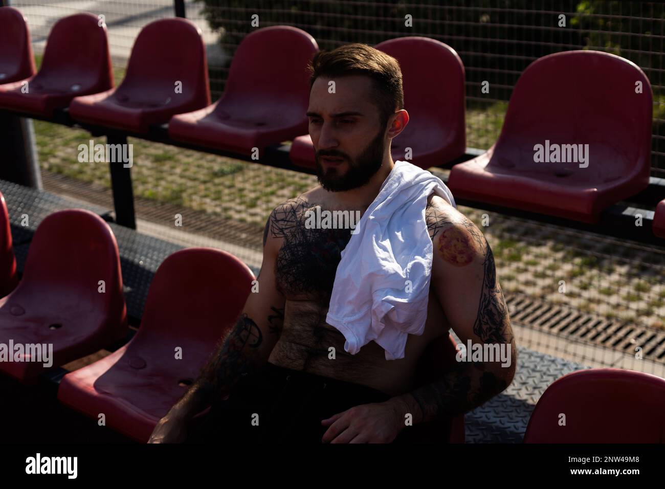 Man resting after training and cooling off. Stock Photo