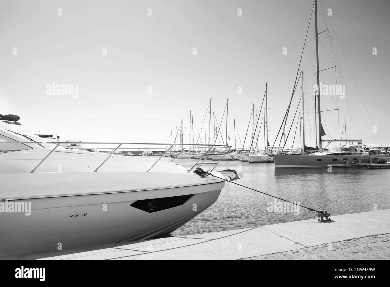 Modern boats near pier. Black and white tone Stock Photo