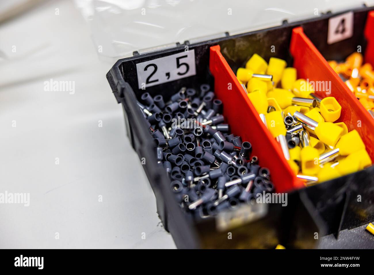 A close up of a tool box with a lot of different electrical pins Stock