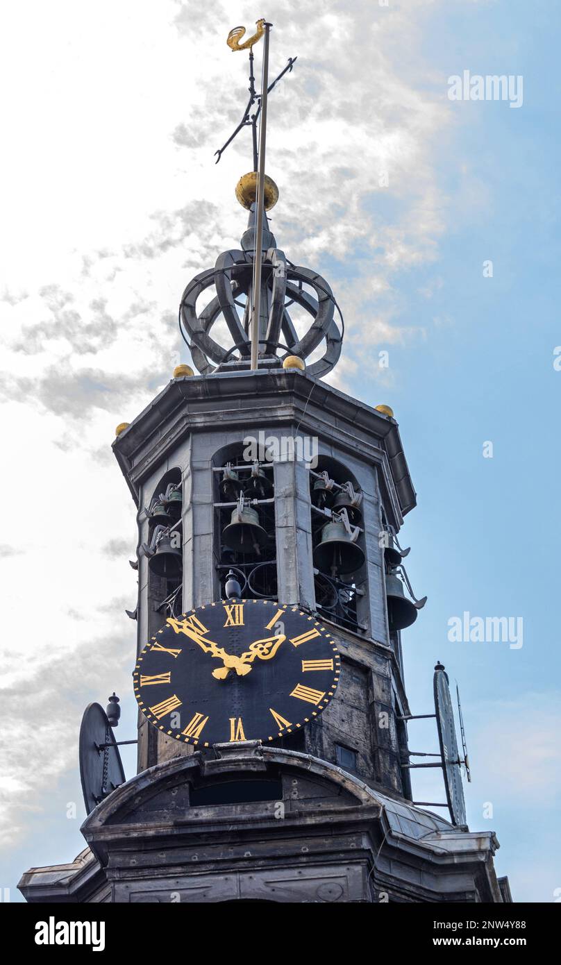 Black Dial Clock With Golden Needles at Church Tower in Amsterdam Stock Photo