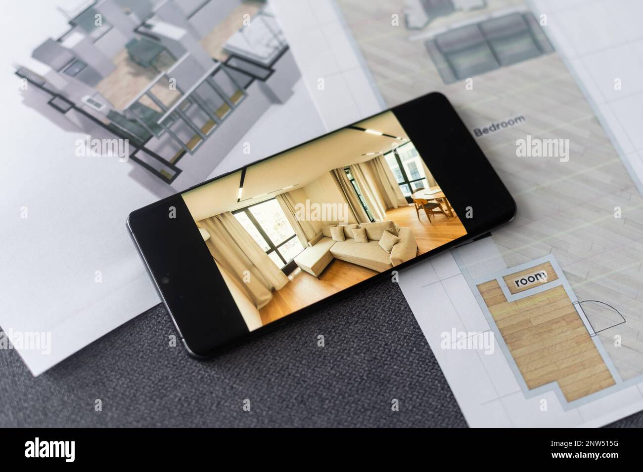 website wireframe sketch and programming code on smartphone Stock Photo