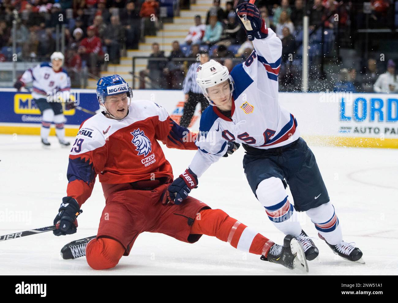 United States Tyler Madden (9) and Czech Republics Jachym Kondelik watch the puck during the first period of a quarterfinal of the world junior hockey championships, Wednesday, Jan