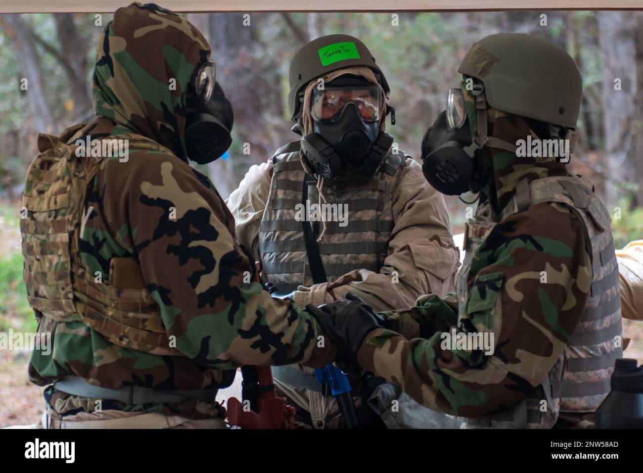 U.S. Airmen assigned to the 628th Civil Engineer Squadron talk amongst ...