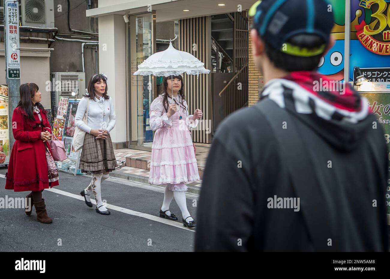 Men who dress like women walking, Akihabara, Tokyo Stock Photo