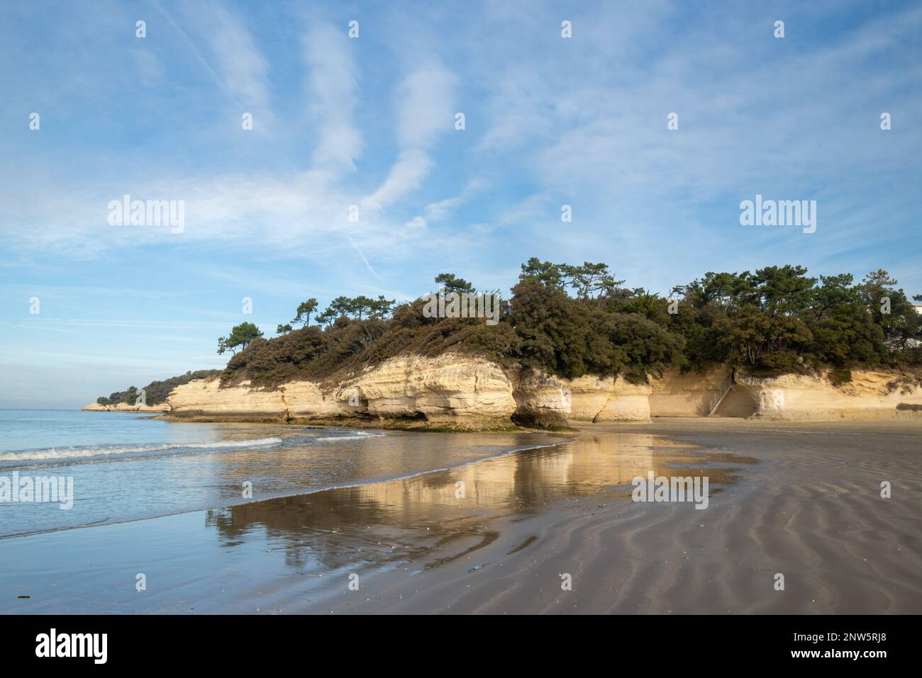 Rocky coastline and sandy beach on west Atlantic coast France in Charente Maritime at Meschers sur Gironde Stock Photo
