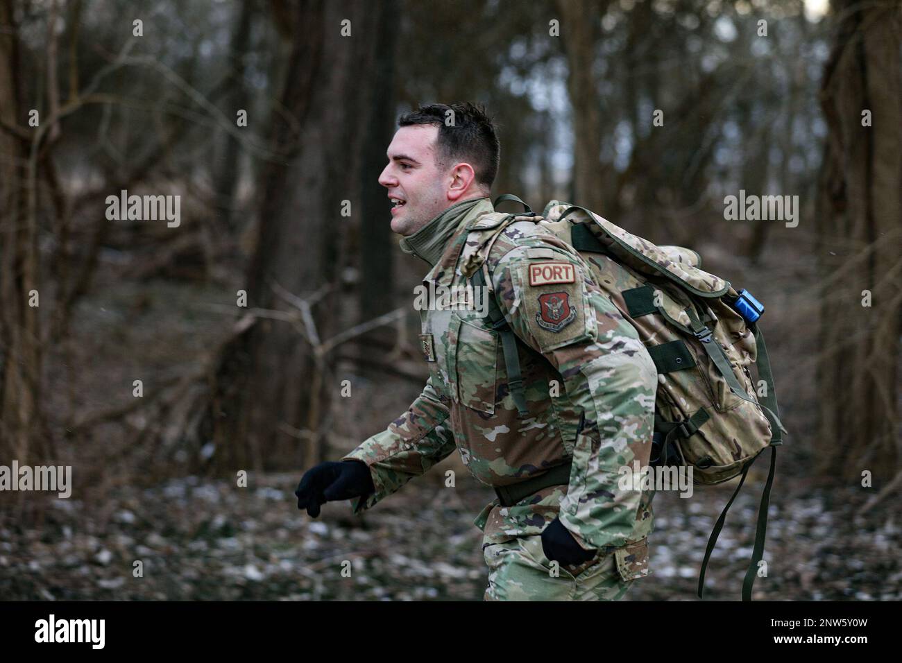 Tech. Sgt. Gabriel Clark, 87th Aerial Port Squadron ramp operations representative, pushes through a 12k ruck-march during the German Armed Forces Military Proficiency Badge qualification at Wright-Patterson Air Force Base, Ohio, Feb 3, 2023. He finished the event with a 1:37:50 runtime. The event started today and ends Friday. The German Armed Forces Team oversaw the event with participating members of the Air Force and AF Reserve. The badge, also known in German as Das Abzeichen fur Leistungen im Truppendienst, is awarded to and worn by German and allied forces. It requires Soldiers to demon Stock Photo