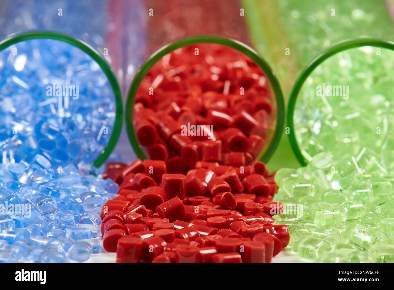 several colored plastic resins in test tubes in laboratory Stock Photo