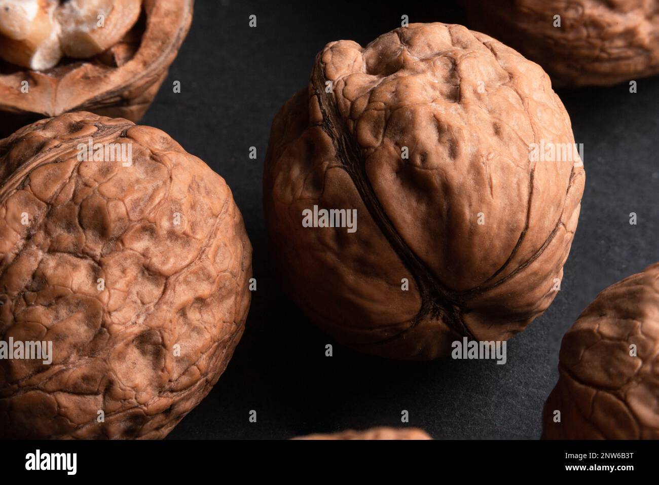 walnuts on black slate background Stock Photo