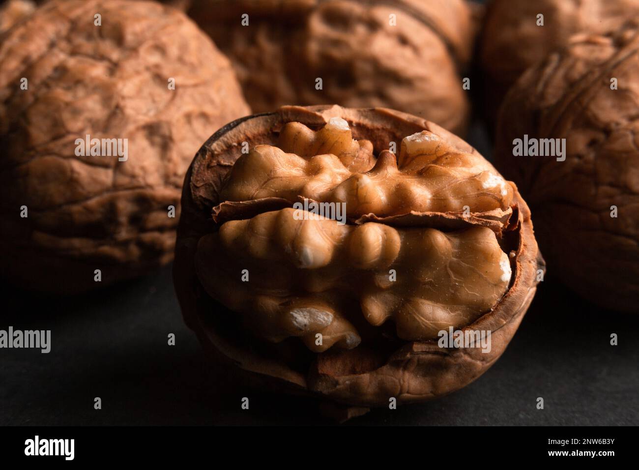 walnuts on black slate background Stock Photo