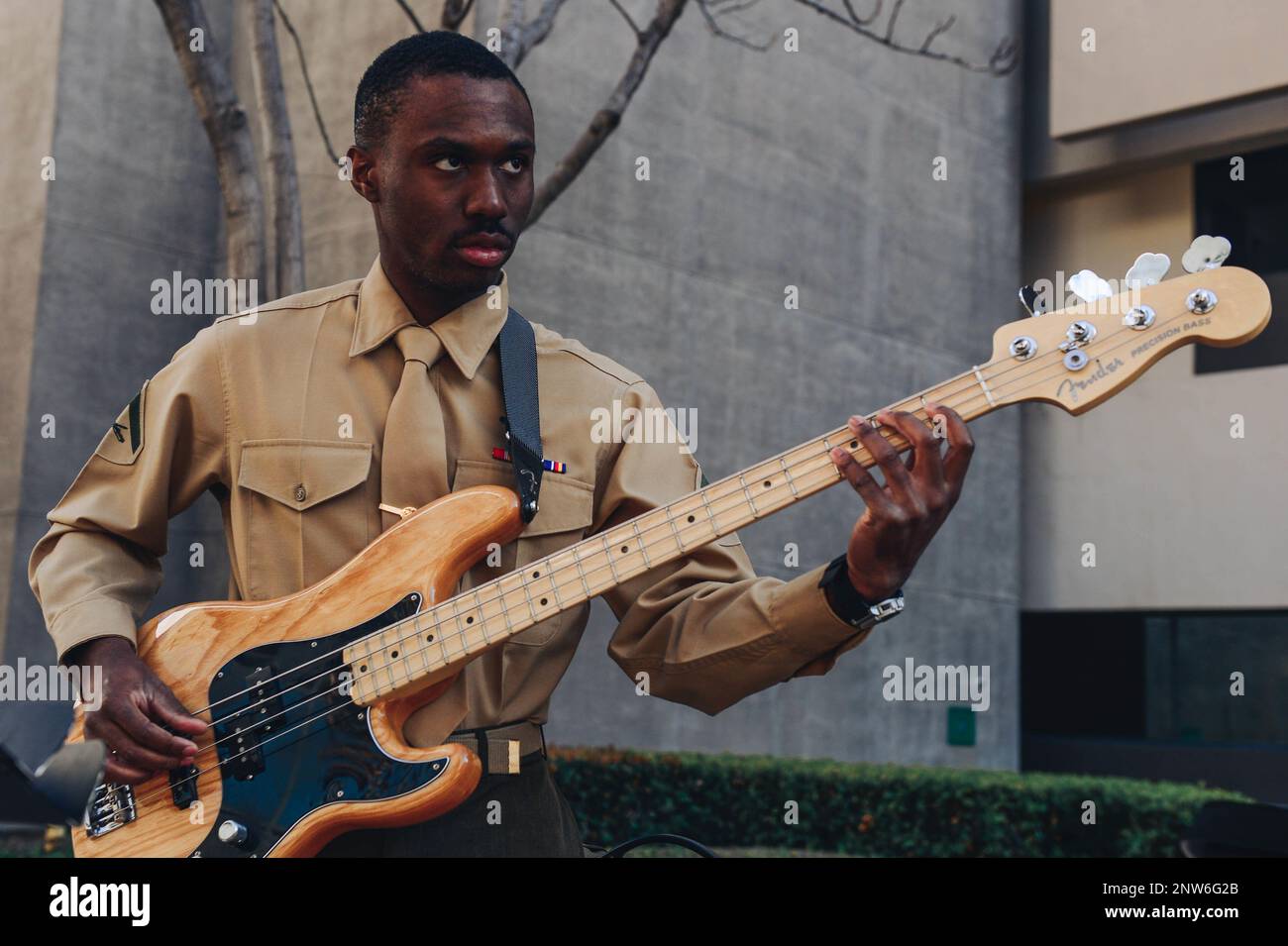 U.S. Marine Corps Lance Cpl. Desean Porchea, a bass guitar player with Marine Corps Band San Diego, performs in a jazz trio at Balboa Naval Medical Center, Jan. 19, 2023. The band plays outreach concerts throughout the region to both military and civilian audiences. Stock Photo