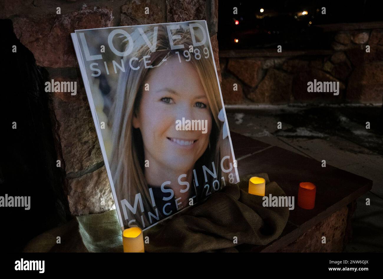 A poster with the picture of the missing Kelsey Berreth is propped up ...