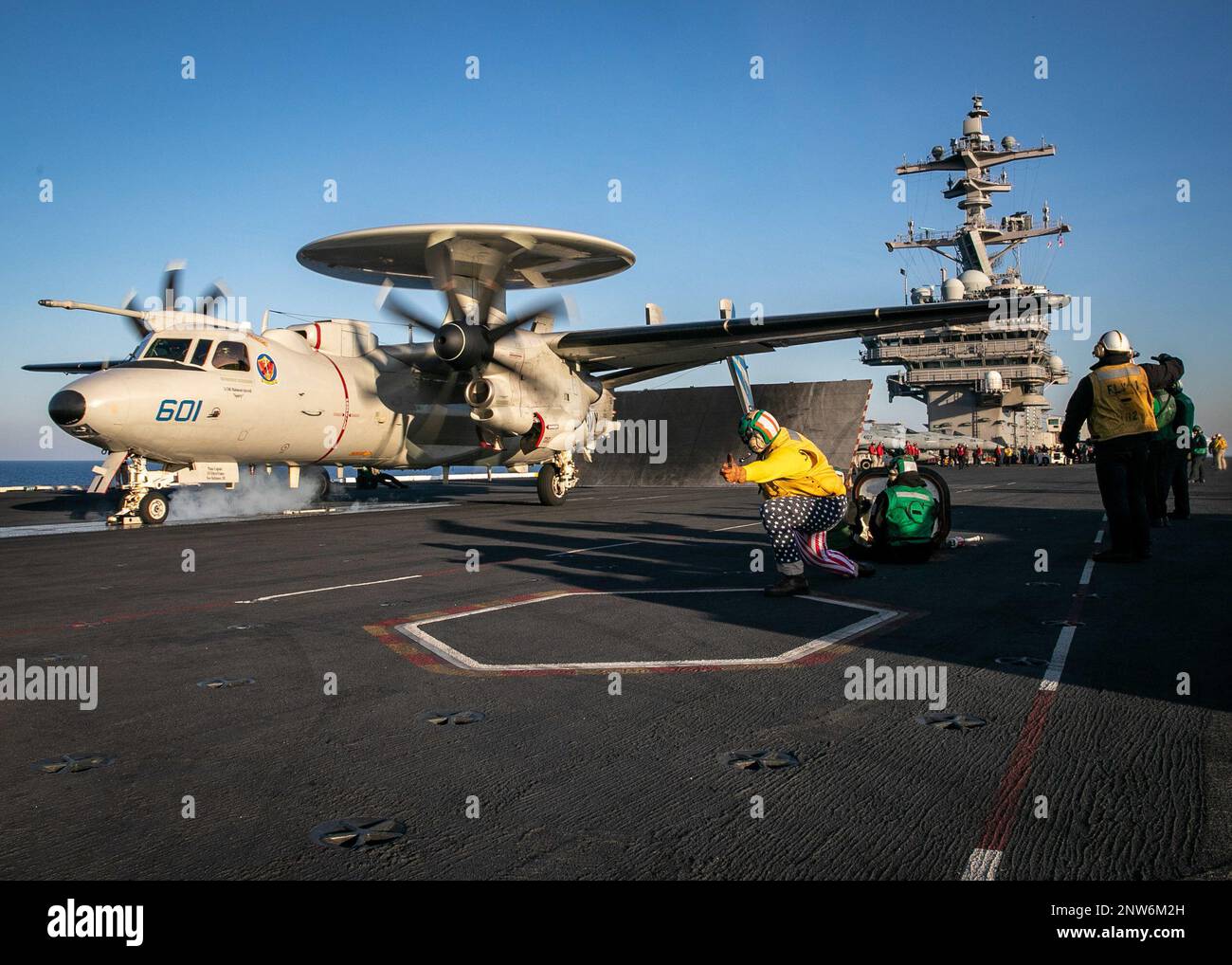 230220-N-EL850-4025 ADRIATIC SEA (Feb. 20, 2023) Lt. Cmdr. Christopher Baker, assigned to the Nimitz-class aircraft carrier USS George H.W. Bush (CVN 77), launches an E-2D Hawkeye, attached to Carrier Airborne Early Warning Squadron (VAW) 121, off of the flight deck during flight operations, Feb. 20, 2023. Carrier Air Wing (CVW) 7 is the offensive air and strike component of Carrier Strike Group (CSG) 10 and the George H.W. Bush CSG. The squadrons of CVW-7 are Strike Fighter Squadron (VFA) 143, VFA-103, VFA-86, VFA-136, Carrier Airborne Early Warning Squadron (VAW) 121, Electronic Attack Squad Stock Photo
