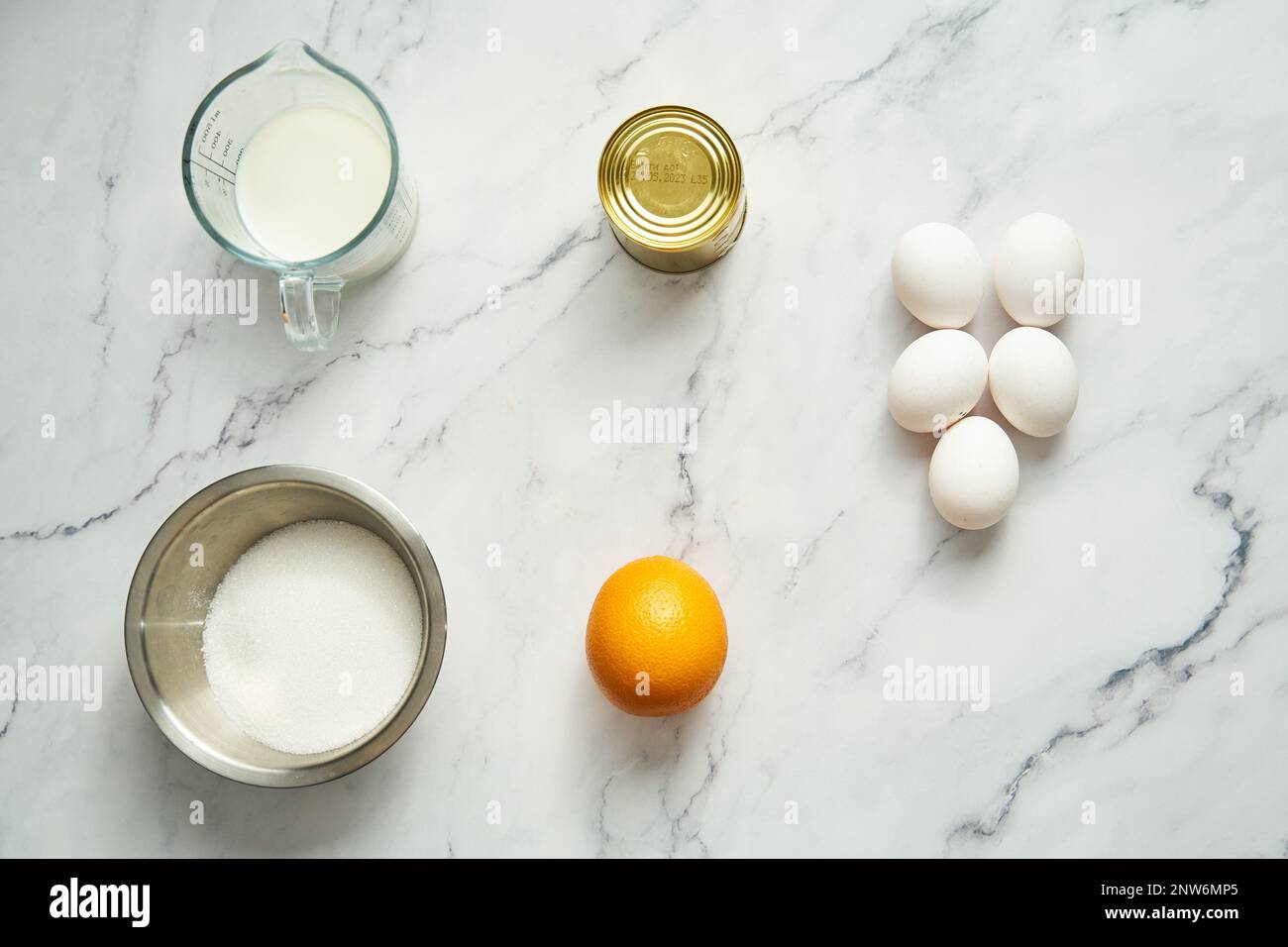 Thin Flan Mexicano ingredients is condensed milk and orange. Eggs and milk and sugar Stock Photo