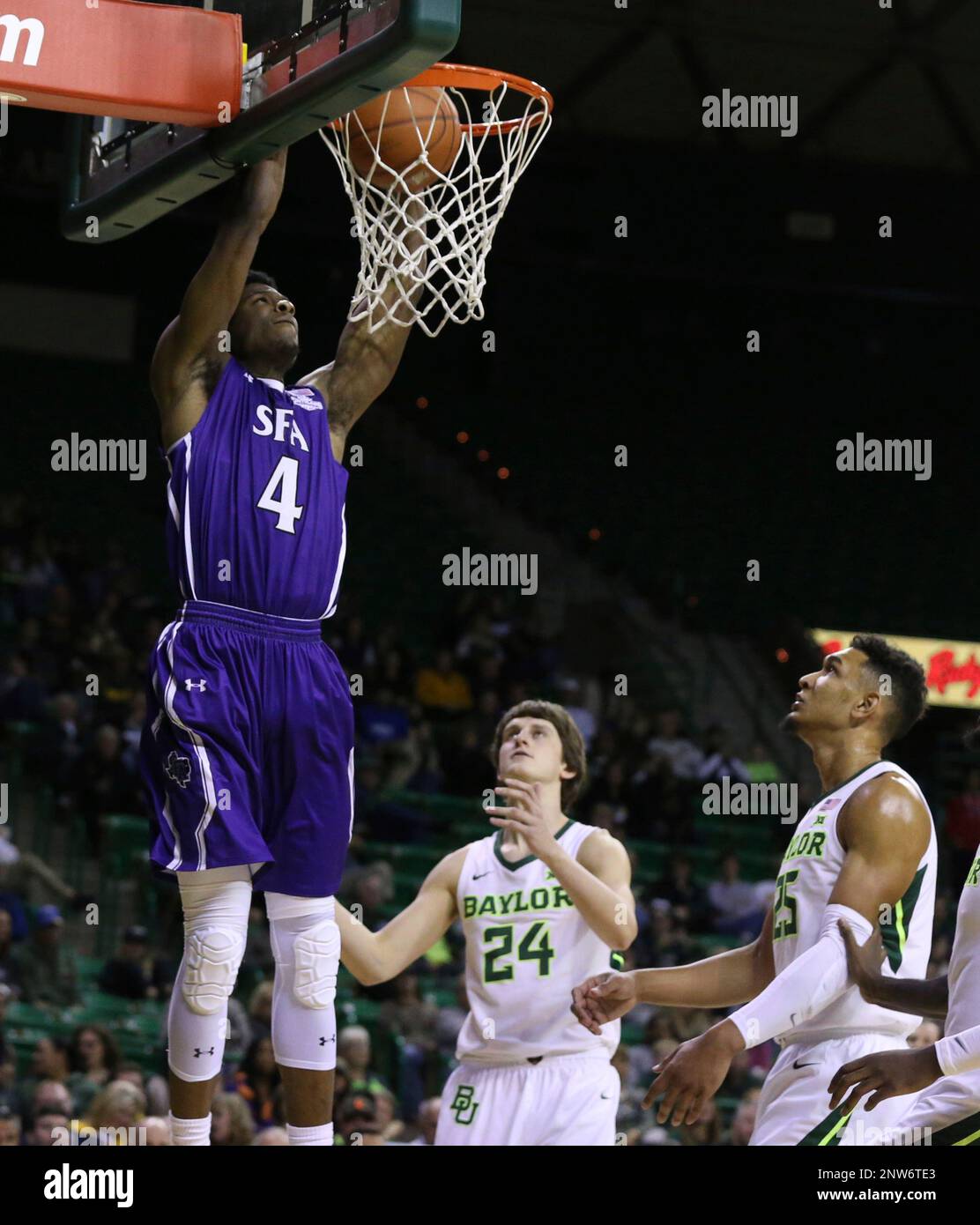 Stephen F. Austin forward Davonte Fitzgerald, left, dunks over Baylor ...