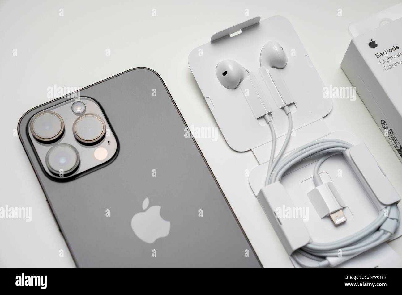 New iPhone 14 pro max and Apple Earpods Airpods white earphones for listening to music and podcasts in an open box. Isolated on white background. Bud Stock Photo Alamy