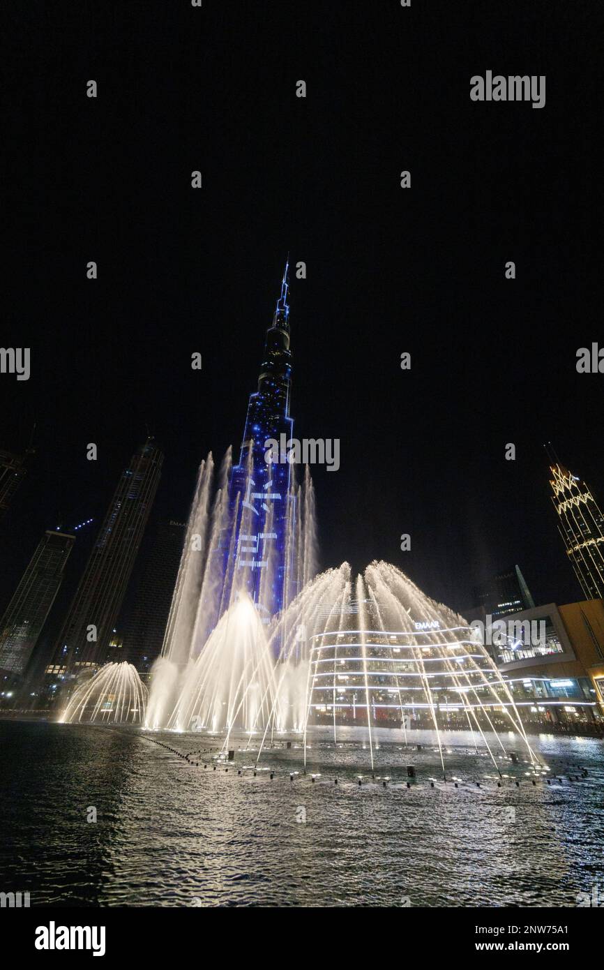 Fountains in Dubai mall overlooking Dubai cityscape and buildings,UAE