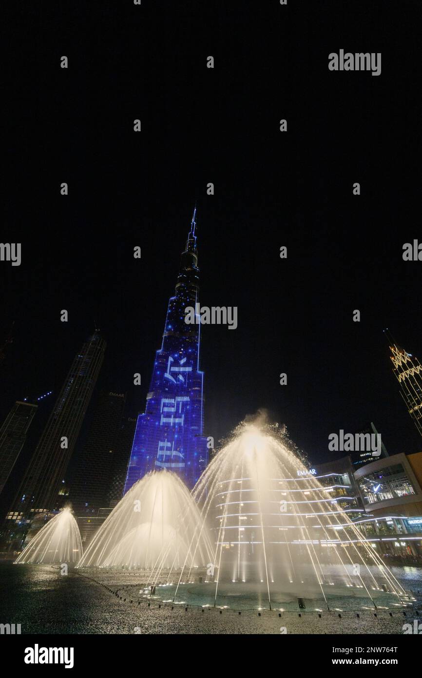 Fountains in Dubai mall overlooking Dubai cityscape and buildings,UAE