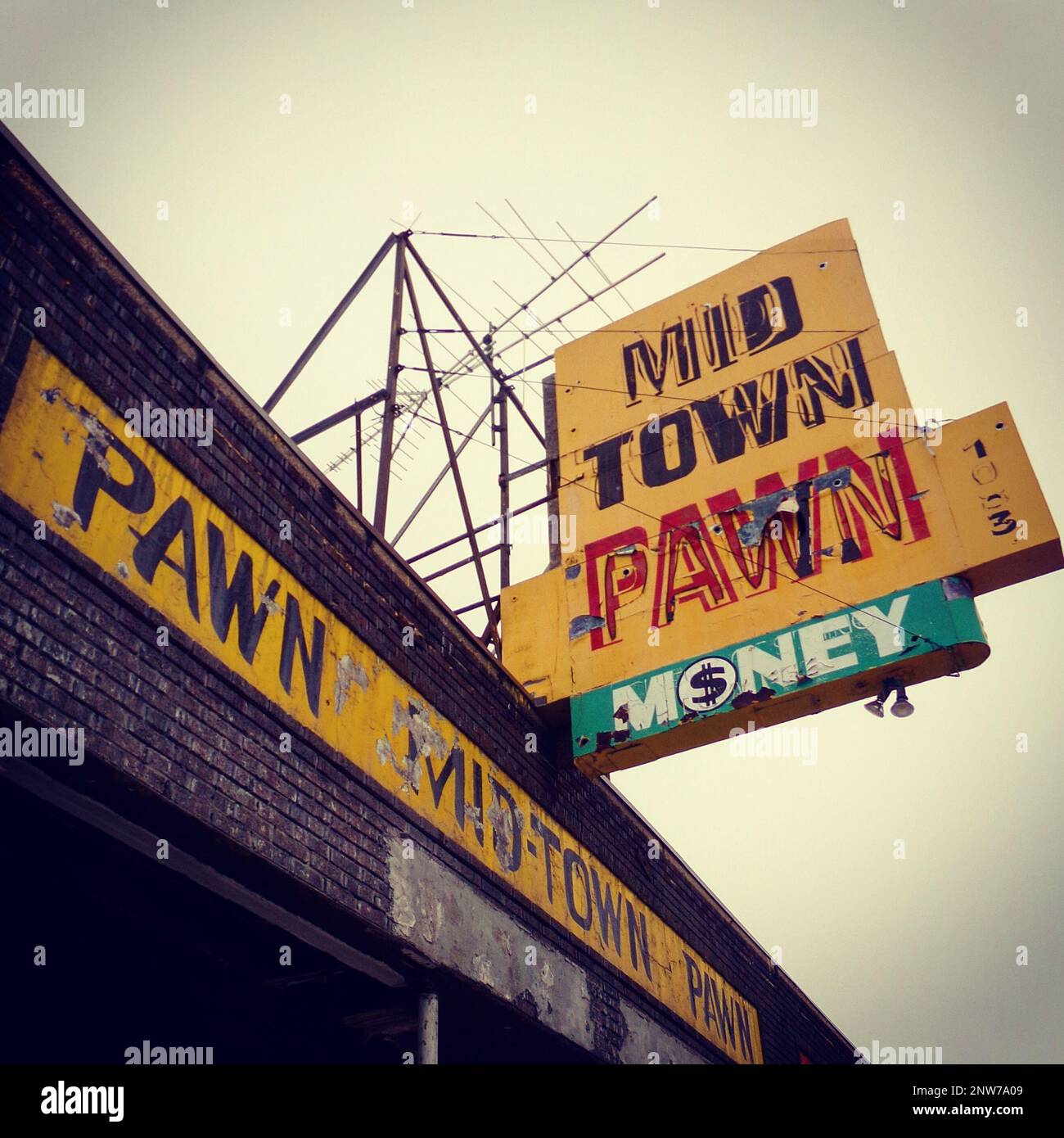 VINTAGE MIDTOWN PAWN SHOP STOREFRONT AND SIGN Stock Photo