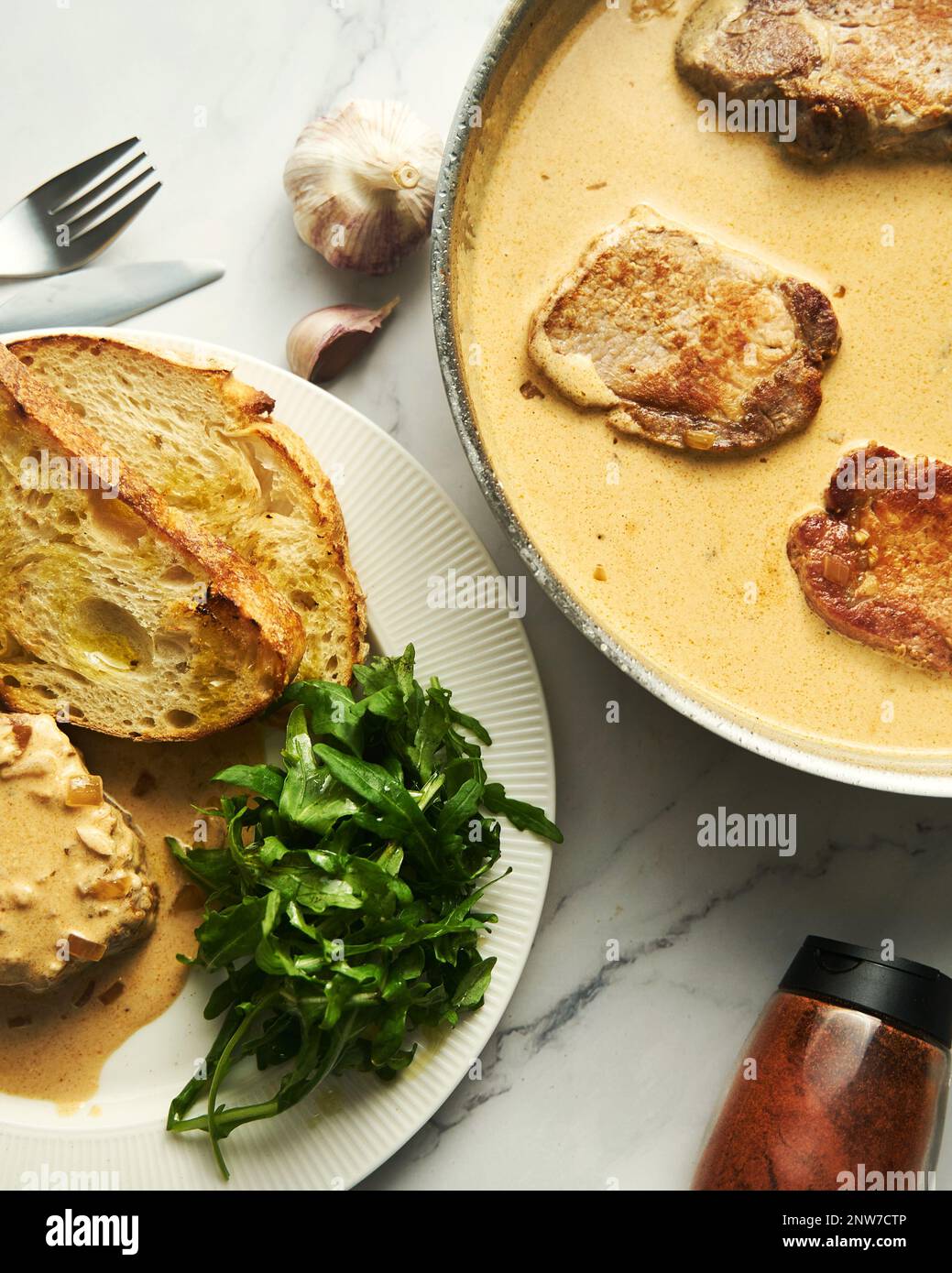 Pork paprikash with onion, butter and garlic. Sauce made from high fat