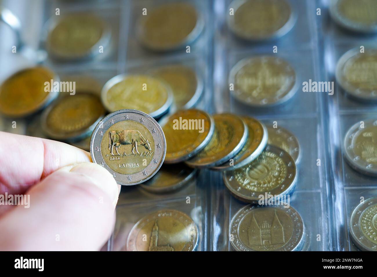 Transparent blister album page with coin collection of 2 euro ...
