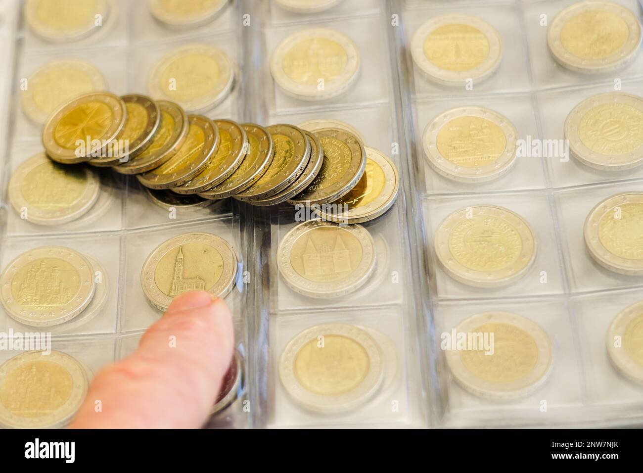 Transparent blister album page with coin collection of 2 euro ...