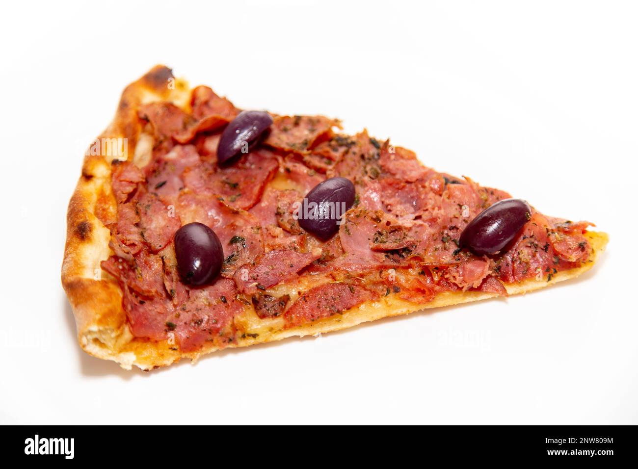 Traditional pepperoni pizza slice in selective focus. Stock Photo