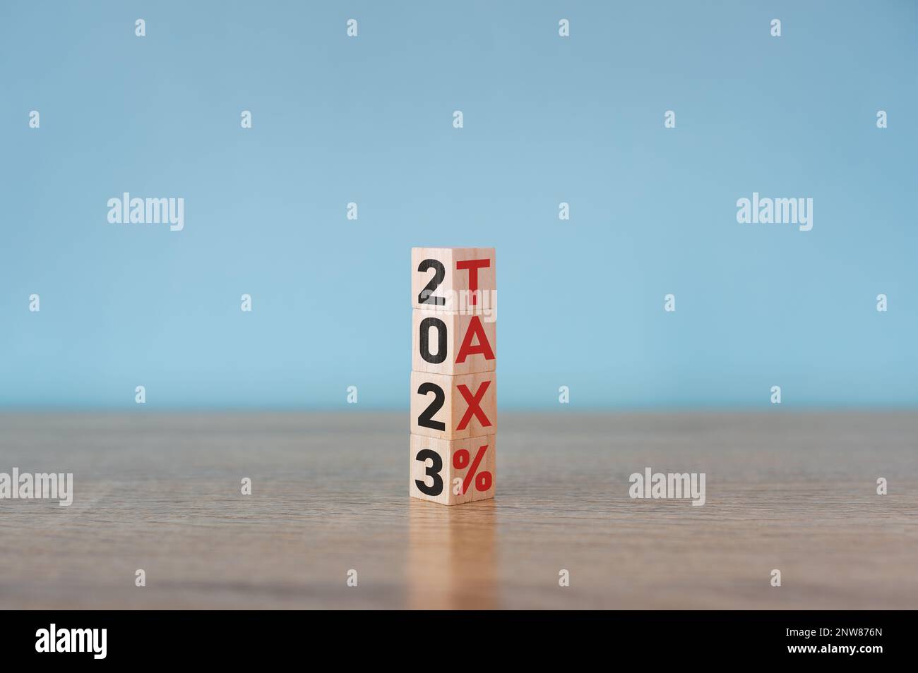 Tax and 2023 number on wooden block. Pay tax in 2023 years. The new