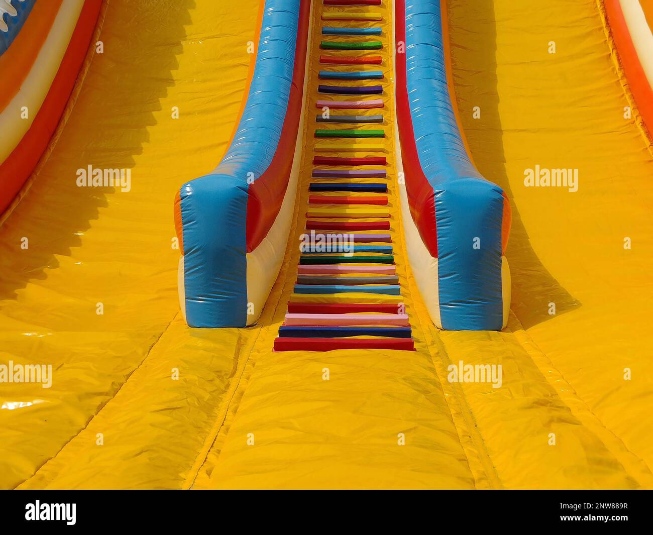 colorful inflatable slide for children. Playing Stock Photo - Alamy