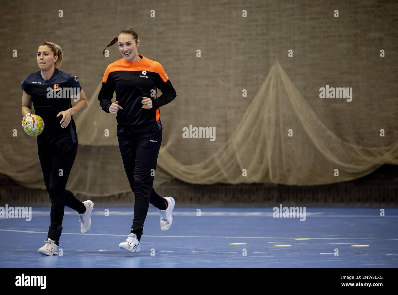 ARNHEM - Estavana Polman and Lois Abbingh of TeamNL Women's Handball during training leading up to the Golden League matches. ANP ROBIN VAN LONKHUIJSEN Stock Photo