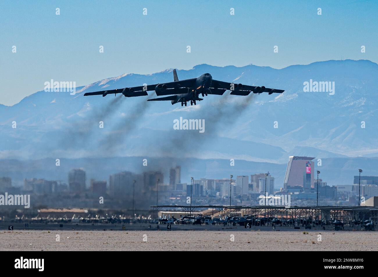 A B-52 Stratofortress from the 2nd Bomb Wing at Barksdale Air Force Base takes off for a Red Flag 23-1 Mission at Nellis Air Force Base, Nevada, Jan. 23, 2022. With approximately 2,200 targets, realistic threat systems and an opposing enemy enemy force that cannot be replicated anywhere else in the world, Nellis and the NTTR enable combat air forces to train to fly, fight and win. Stock Photo