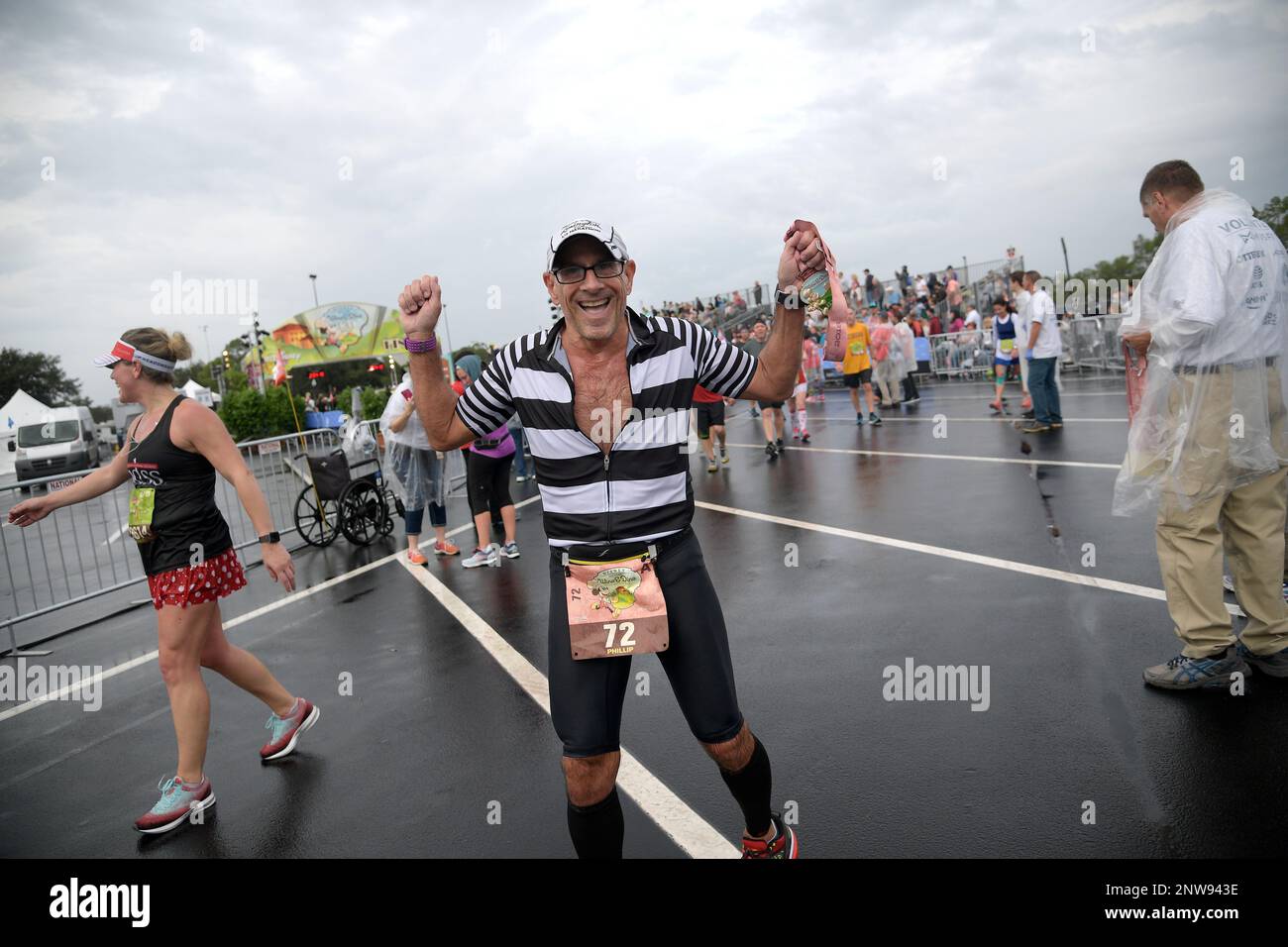 Runners receive their medals after participating in the Disney Wine