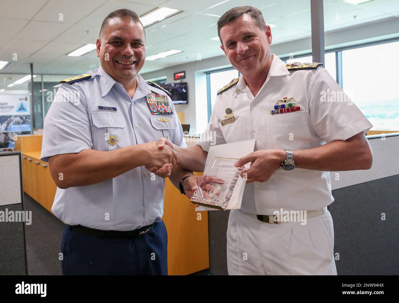U.S. Coast Guard Vice Adm. Andrew Tiongson shakes hands with Vice Adm ...