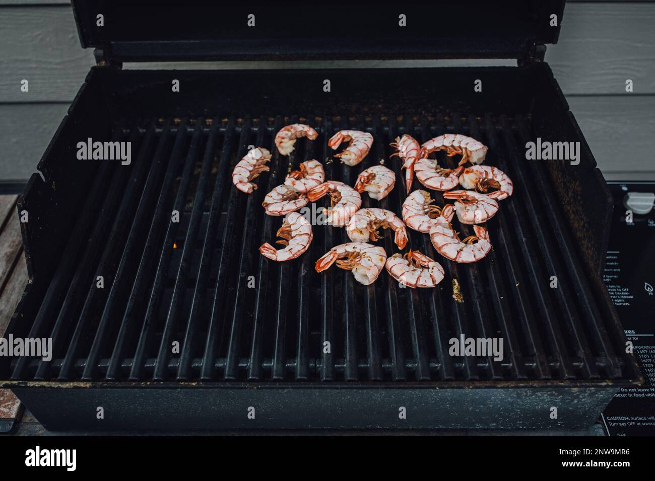 loose Patagonian prawns with shell on the barbecue, shrimp on the barbie Stock Photo