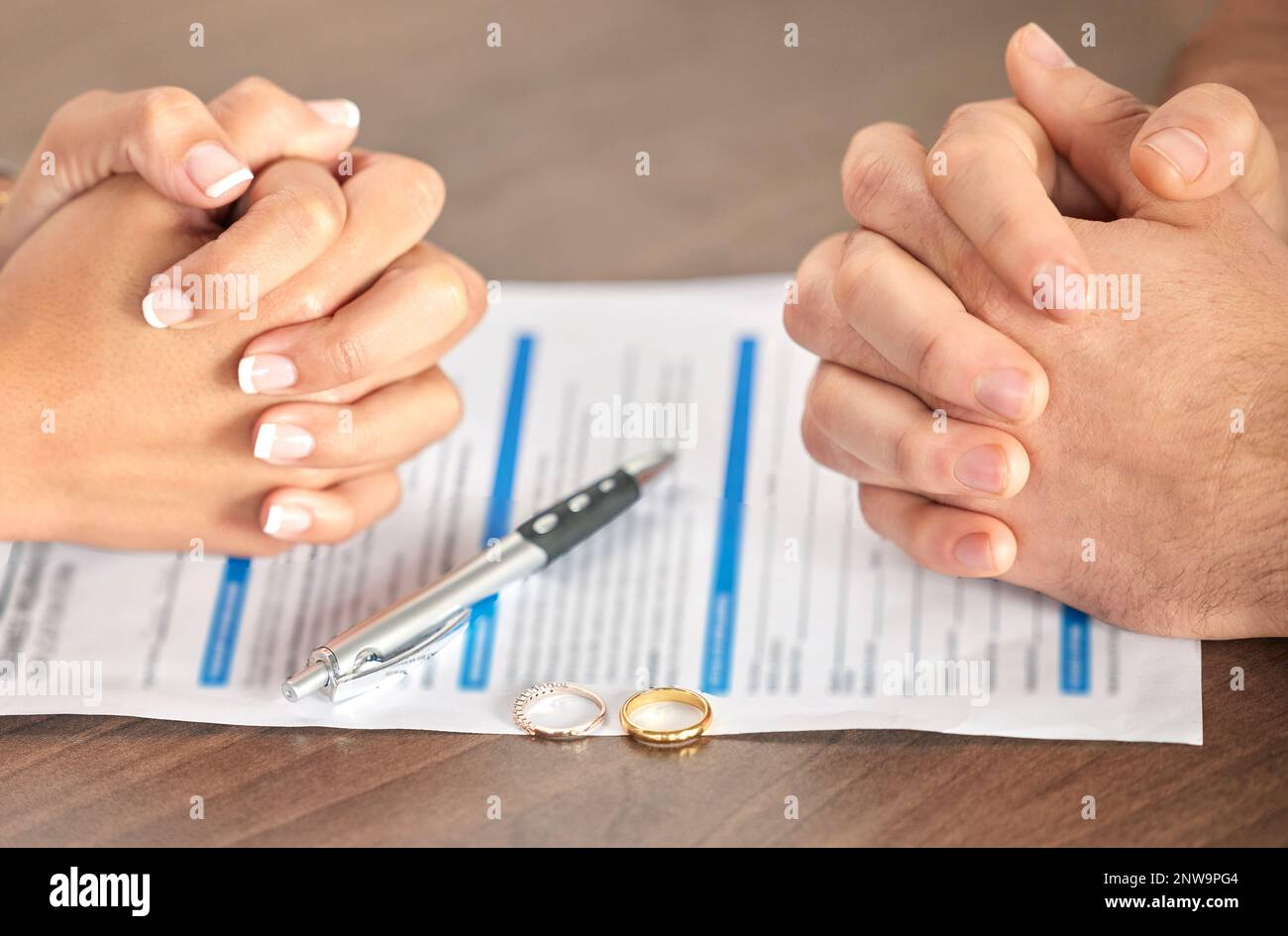Divorce, signing and hands of a couple with a document for court, deal