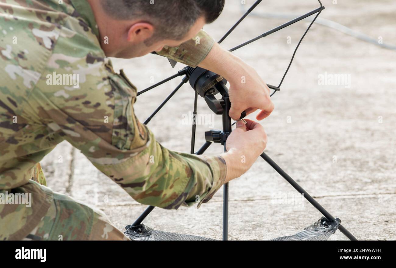 U.S. Air Force Master Sgt. Justin Thornton,  Communications Squadron satellite communications operator, assembles communication equipment during Exercise Forward Tiger at Muniz Air National Guard Base, Puerto Rico, Feb. 14, 2023. Forward Tiger provides joint training and improves readiness of U.S. and partner nation military personnel through interoperability training. Stock Photo