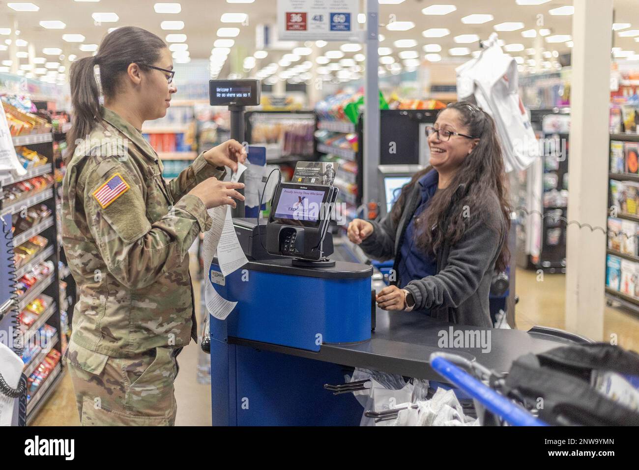 “It’s always good to put the things you have coupons for at the front,” said Spc. Janice Coulter at the main Exchange at Fort Bliss, Texas, Feb. 9, 2023. The 11th Air Defense Artillery Brigade, 32nd Army Air and Missile Defense Command Soldier and active-duty Army spouse said she’s been an avid couponer since becoming a mother and enjoys sharing her tips on saving money at the register with other military families. Stock Photo