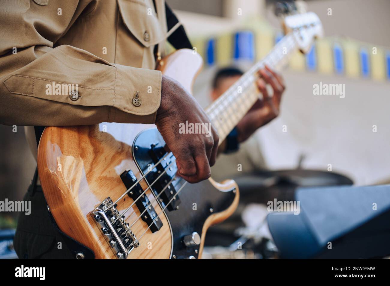 U.S. Marine Corps Lance Cpl. Desean Porchea, a bass guitar player with Marine Corps Band San Diego, performs in a jazz trio at Balboa Naval Medical Center, Jan. 19, 2023. The band plays outreach concerts throughout the region to both military and civilian audiences. Stock Photo
