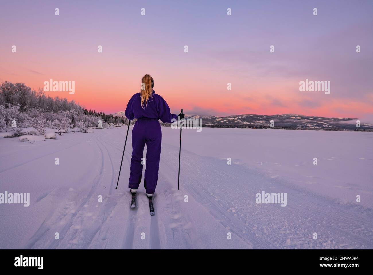 Amazing pastel sunset views along the Yukon River with one person