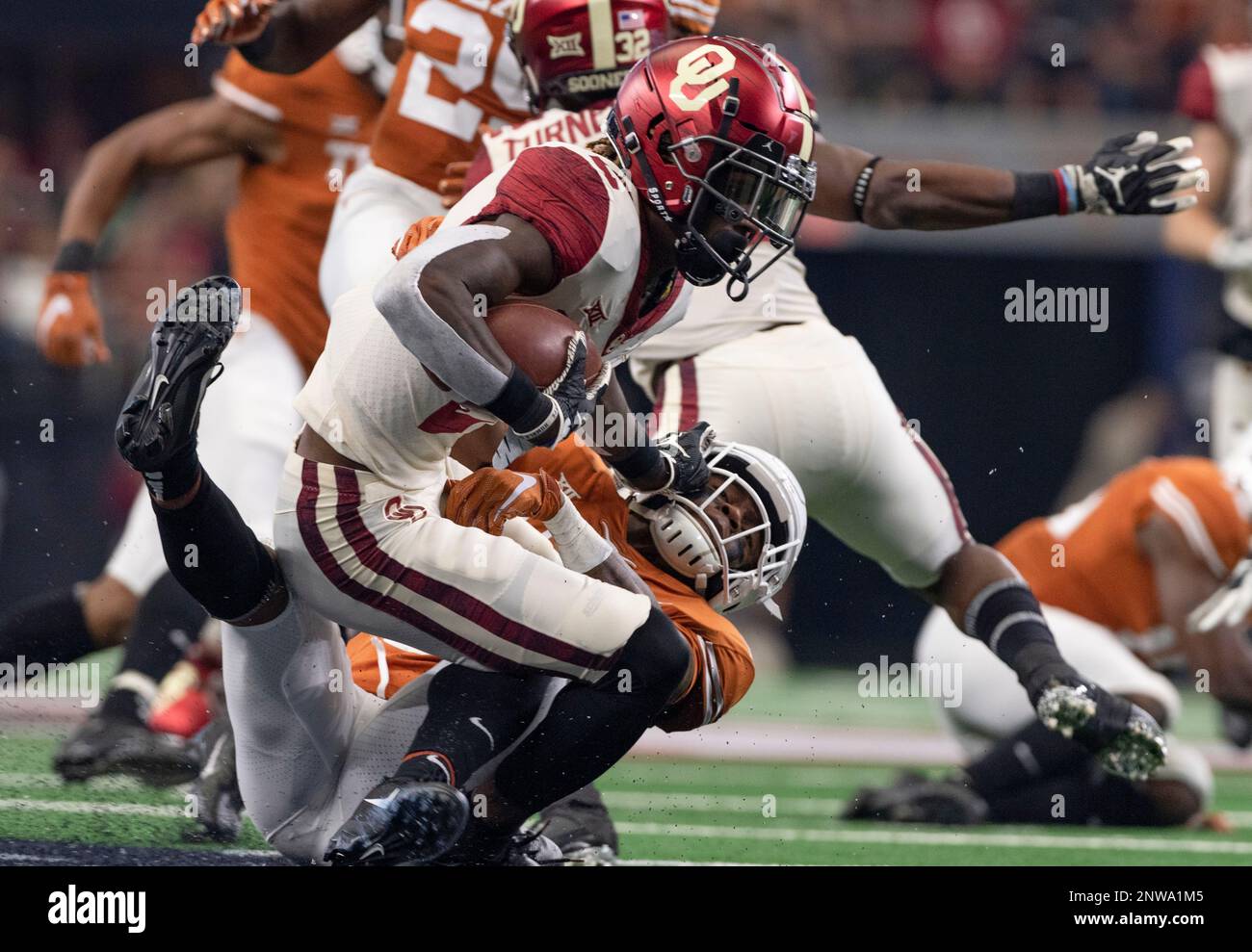 https://c8.alamy.com/comp/2NWA1M5/oklahoma-special-teams-ceedee-lamb-2-is-tackled-by-texas-defensive-back-josh-thompson-29-as-he-attempts-to-return-a-kick-during-the-big-12-conference-championship-ncaa-football-game-saturday-december-1-2018-in-arlington-tex-oklahoma-leads-20-14-at-the-halftime-tfv-media-via-ap-2NWA1M5.jpg