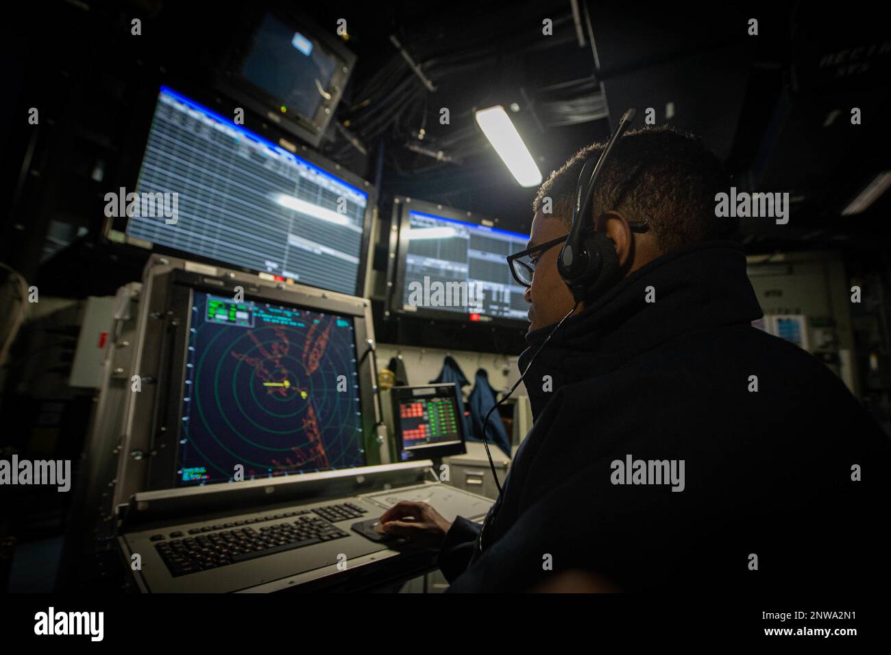 230111-N-JC256-1075 NORFOLK, Va. (Jan. 11, 2023) Air Traffic Controlman Airman Recruit Yovanny Acosta, from Jacksonville, Florida, receives training on aircraft recovery aboard the Nimitz-class aircraft carrier USS Dwight D. Eisenhower (CVN 69). IKE is currently pier side in Naval Station Norfolk conducting routine maintenance. Stock Photo