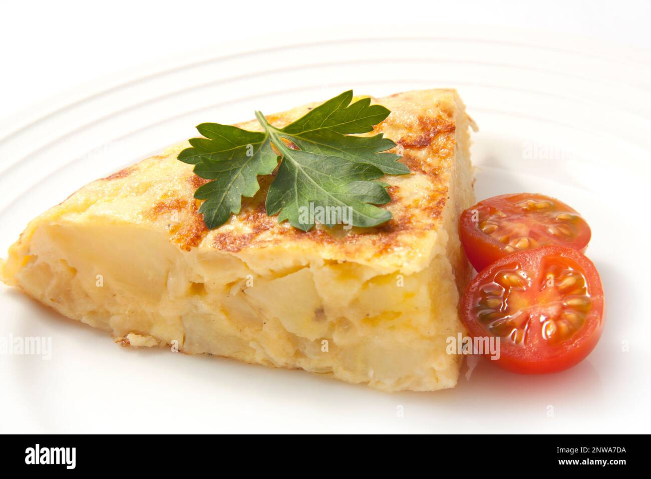 Tortilla española. Spanish omelette with potatoes and onion. Stock Photo